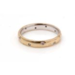 A diamond and 18ct yellow gold eternity ring,