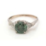 A green diamond and diamond ring,