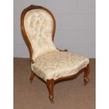 A Victorian carved walnut framed spoon back salon chair, and two others.