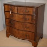 A George III style mahogany serpentine fronted chest.