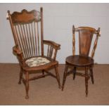 A late Victorian beech and oak upright armchair, and another.