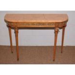 A reproduction Italian style marble-topped console table.