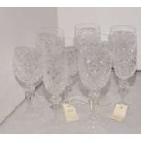 Two sets of Waterford Crystal Glasses, wine and champagne.