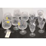Set of six crystal brandy glasses; and set of six liqueur glasses, various makers.