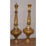 A pair of Indian pierced brass floor standing lamps.