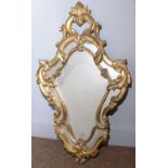 A French gilt-gesso wall mirror.