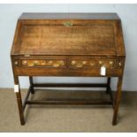 A George III oak slope front bureau