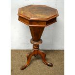 A Victorian burr walnut octagonal table with lift up lift to