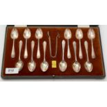 A set of twelve silver coffee spoons and tongs, by Walker & Hall,