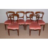 A set of six Victorian mahogany balloon back dining chairs.