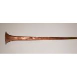 A copper and brass hunting horn.
