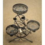 A 20th Century three-tier pressed metal plant stand.