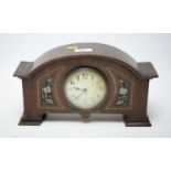 An Arts & Crafts inlaid oak mantle clock