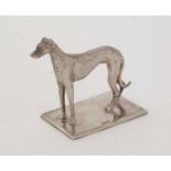 A silver table ornament in the form of a whippet,