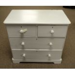 A cream-painted pine chest