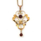 An Edwardian red stone and 9ct yellow gold pendant on chain,