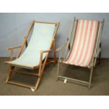 Two vintage beech-framed folding deckchairs.