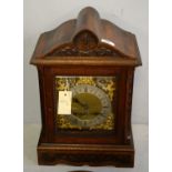 An oak cased mantel clock, by George Davison & Sons.