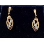 A pair of 9ct yellow gold, ruby and diamond drop earrings.