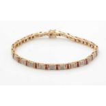 A ruby and diamond tennis bracelet,