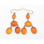 A pair of amber drop earrings,