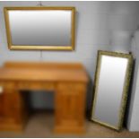 Two gilt framed wall mirrors.