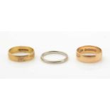 Three gold wedding bands