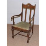 An early 20th Century oak upright armchair.