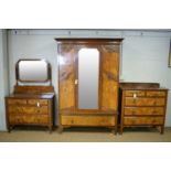 An early 20th Century figured walnut bedroom suite
