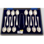 A set of twelve silver teaspoons and sugar tongs, by W S Savage & Co,