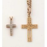Two crucifix pendants and a chain.