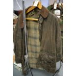 A gent's Barbour jacket; and two gilets, various makers.