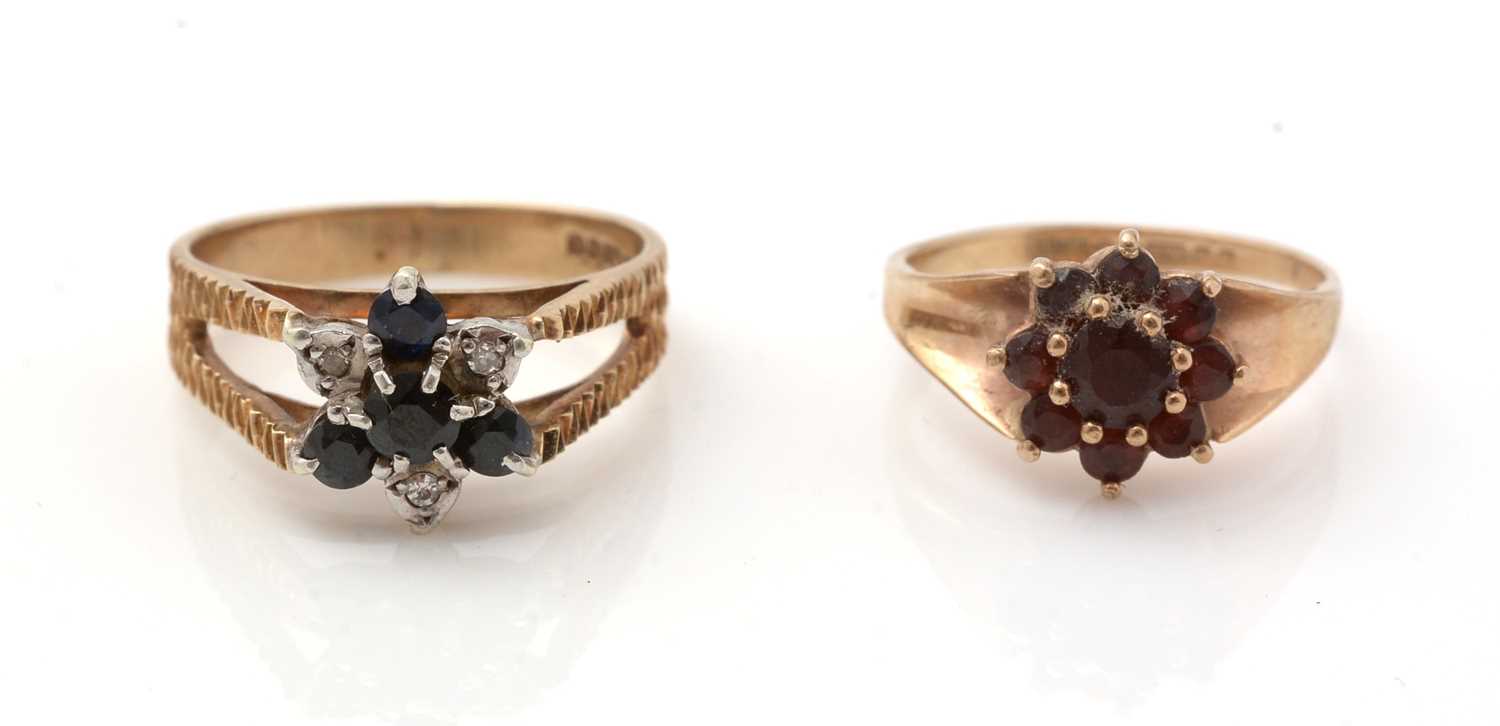 A sapphire and diamond cluster ring and a garnet cluster ring,