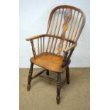 A ash and elm Windsor armchair with stretcher.