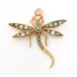 An opal set dragonfly pattern pendant,