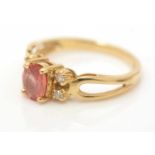 A pink sapphire and diamond ring,