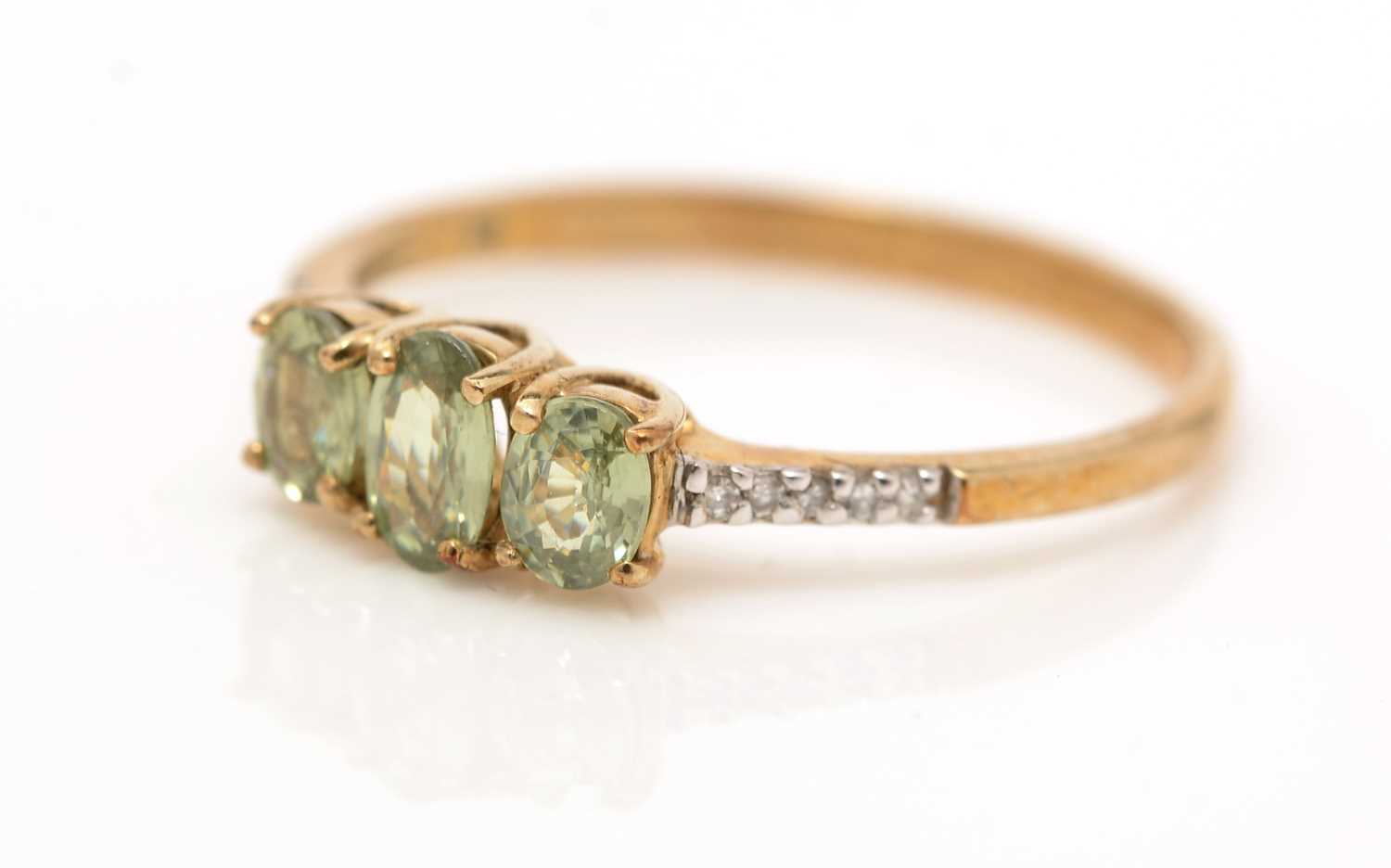 A gemstone and diamond ring,