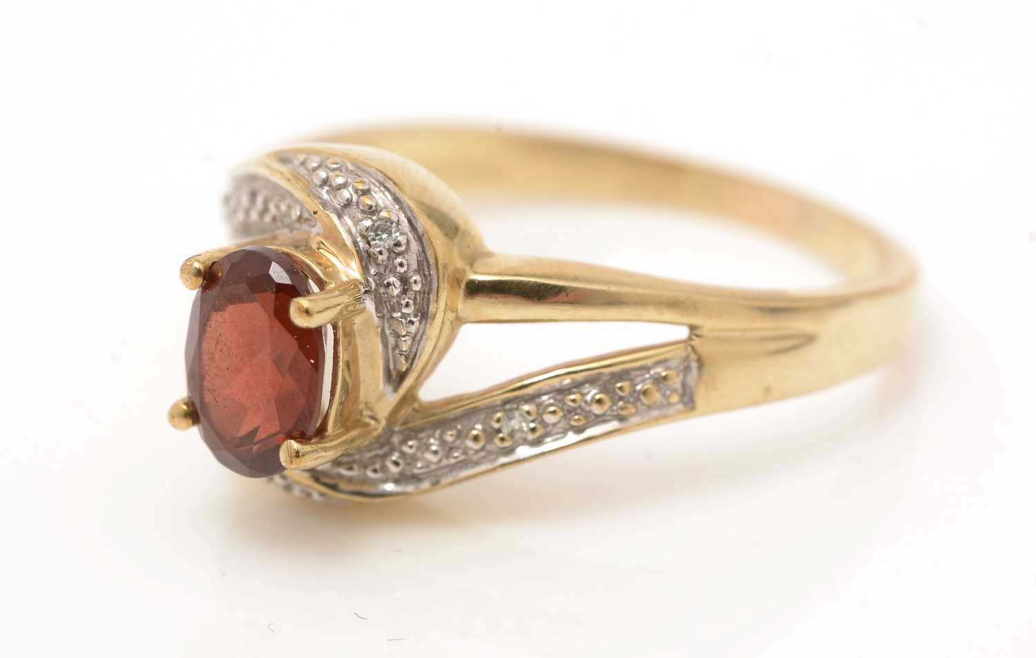 A garnet and diamond ring