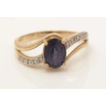 An iolite and diamond ring,