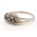 A gemstone and diamond ring,