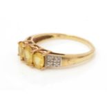 A yellow sapphire and diamond ring,