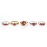 Five ruby and white stone rings,