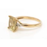 A golden beryl and diamond ring,