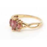 A pink sapphire and diamond ring