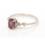 An almandine garnet and diamond ring,