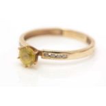 A yellow zircon and diamond ring