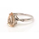 A golden beryl and diamond ring,