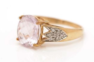 A kunzite and diamond ring