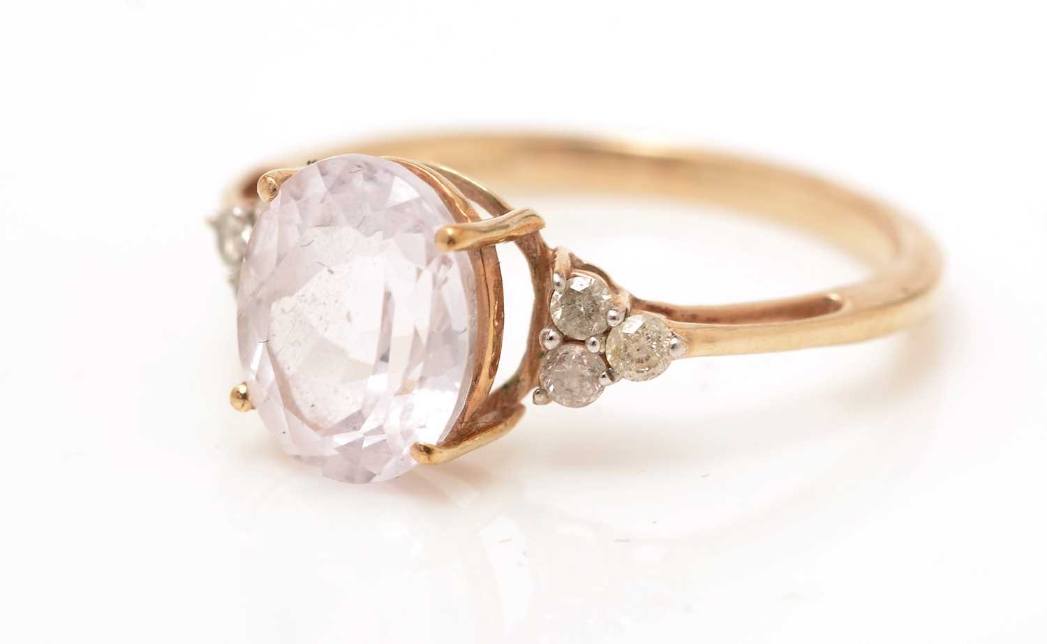 A kunzite and diamond ring