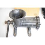 A vintage Kenrick cast metal mincer or grinder.